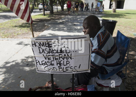 Charleston, SC, USA. 18th Sep, 2016. JAMES JAMISON, 53, sits along a sidewalk near a city park, hoping for donations so he can eat. A U.S. Marine Corps veteran of 12 years and former truck driver, he is now disabled and homeless, waiting for his military pension to begin. ''I can't stay in the one shelter in this town, it's like a prison, '' he said. ''I'd rather take my chances out here, sleeping in the park or wherever I can lay my head. © Robin Rayne Nelson/ZUMA Wire/Alamy Live News Stock Photo