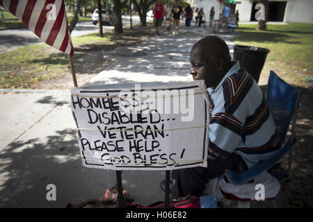 Charleston, SC, USA. 18th Sep, 2016. JAMES JAMISON, 53, sits along a sidewalk near a city park, hoping for donations so he can eat. A U.S. Marine Corps veteran of 12 years and former truck driver, he is now disabled and homeless, waiting for his military pension to begin. ''I can't stay in the one shelter in this town, it's like a prison, '' he said. ''I'd rather take my chances out here, sleeping in the park or wherever I can lay my head. © Robin Rayne Nelson/ZUMA Wire/Alamy Live News Stock Photo