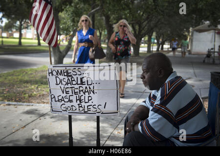 Charleston, SC, USA. 18th Sep, 2016. JAMES JAMISON, 53, sits along a sidewalk near a city park, hoping for donations so he can eat. A U.S. Marine Corps veteran of 12 years and former truck driver, he is now disabled and homeless, waiting for his military pension to begin. ''I can't stay in the one shelter in this town, it's like a prison, '' he said. ''I'd rather take my chances out here, sleeping in the park or wherever I can lay my head. © Robin Rayne Nelson/ZUMA Wire/Alamy Live News Stock Photo