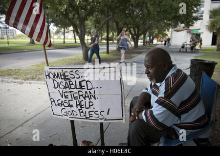 Charleston, SC, USA. 18th Sep, 2016. JAMES JAMISON, 53, sits along a sidewalk near a city park, hoping for donations so he can eat. A U.S. Marine Corps veteran of 12 years and former truck driver, he is now disabled and homeless, waiting for his military pension to begin. ''I can't stay in the one shelter in this town, it's like a prison, '' he said. ''I'd rather take my chances out here, sleeping in the park or wherever I can lay my head. © Robin Rayne Nelson/ZUMA Wire/Alamy Live News Stock Photo