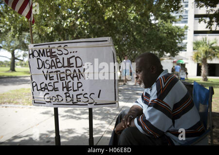 Charleston, SC, USA. 18th Sep, 2016. JAMES JAMISON, 53, sits along a sidewalk near a city park, hoping for donations so he can eat. A U.S. Marine Corps veteran of 12 years and former truck driver, he is now disabled and homeless, waiting for his military pension to begin. ''I can't stay in the one shelter in this town, it's like a prison, '' he said. ''I'd rather take my chances out here, sleeping in the park or wherever I can lay my head. © Robin Rayne Nelson/ZUMA Wire/Alamy Live News Stock Photo