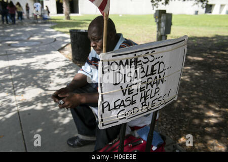 Charleston, SC, USA. 18th Sep, 2016. JAMES JAMISON, 53, sits along a sidewalk near a city park, hoping for donations so he can eat. A U.S. Marine Corps veteran of 12 years and former truck driver, he is now disabled and homeless, waiting for his military pension to begin. ''I can't stay in the one shelter in this town, it's like a prison, '' he said. ''I'd rather take my chances out here, sleeping in the park or wherever I can lay my head. © Robin Rayne Nelson/ZUMA Wire/Alamy Live News Stock Photo