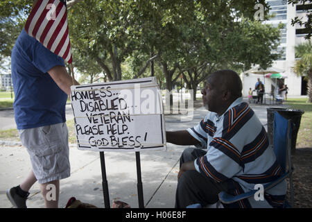 Charleston, SC, USA. 18th Sep, 2016. JAMES JAMISON, 53, sits along a sidewalk near a city park, hoping for donations so he can eat. A U.S. Marine Corps veteran of 12 years and former truck driver, he is now disabled and homeless, waiting for his military pension to begin. ''I can't stay in the one shelter in this town, it's like a prison, '' he said. ''I'd rather take my chances out here, sleeping in the park or wherever I can lay my head. © Robin Rayne Nelson/ZUMA Wire/Alamy Live News Stock Photo