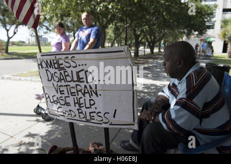 Charleston, SC, USA. 18th Sep, 2016. JAMES JAMISON, 53, sits along a sidewalk near a city park, hoping for donations so he can eat. A U.S. Marine Corps veteran of 12 years and former truck driver, he is now disabled and homeless, waiting for his military pension to begin. ''I can't stay in the one shelter in this town, it's like a prison, '' he said. ''I'd rather take my chances out here, sleeping in the park or wherever I can lay my head. © Robin Rayne Nelson/ZUMA Wire/Alamy Live News Stock Photo