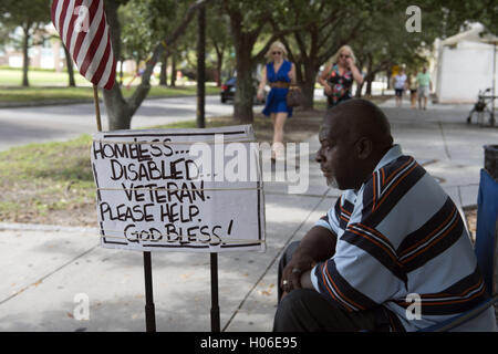 Charleston, SC, USA. 18th Sep, 2016. JAMES JAMISON, 53, sits along a sidewalk near a city park, hoping for donations so he can eat. A U.S. Marine Corps veteran of 12 years and former truck driver, he is now disabled and homeless, waiting for his military pension to begin. ''I can't stay in the one shelter in this town, it's like a prison, '' he said. ''I'd rather take my chances out here, sleeping in the park or wherever I can lay my head. © Robin Rayne Nelson/ZUMA Wire/Alamy Live News Stock Photo