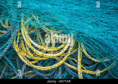 Piles of colorful fishing rope and net at Trout River, Newfoundland and Labrador, Canada. Stock Photo