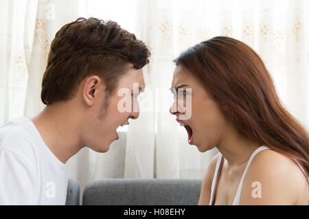 Asian Married couple arguing at home Stock Photo