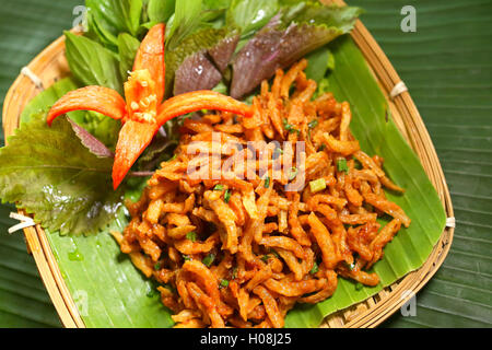 Vietnamese deep fried baby fish on tray of banana leaf Stock Photo