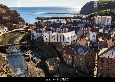 Winding alleys, fishing boats and sea, elevated view in summer, Staithes, North Yorkshire Moors National Park, Yorkshire, UK Stock Photo