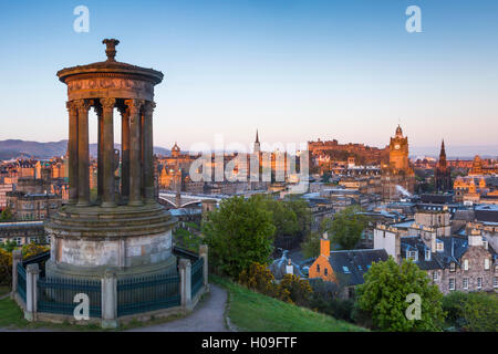 Dawn breaks over the Dugald Stewart Monument overlooking the city of Edinburgh, Lothian, Scotland, United Kingdom, Europe Stock Photo