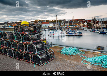 Sailing boats and crab pots at dusk in the harbour at Anstruther, Fife, East Neuk, Scotland, United Kingdom, Europe Stock Photo