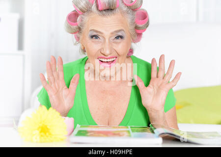 Senior woman in  hair rollers Stock Photo