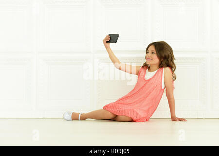 cute little girl  with mobile phone Stock Photo
