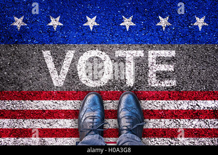 Legs on asphalt road with the word vote, american election concept Stock Photo