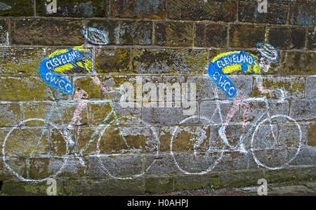 Cycling mural on stone wall in village of Great Ayton  on route of Stage 3 of Tour de Yorkshire, 1st May 2016, North Yorkshire Stock Photo