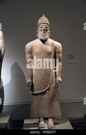 Limestone male figure. Cypriot, Archaic. Last quarter of the 6th century BC. Temple at Golgoi. Stock Photo