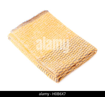 Folded yellow towel isolated over the white background Stock Photo