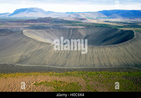 Deep crater seen from helicopter with other craters in the back. Stock Photo