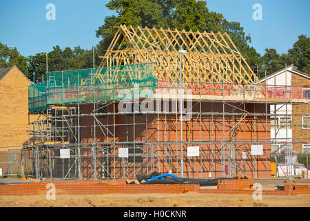 A new development of affordable homes, with new foundations in the foreground Stock Photo