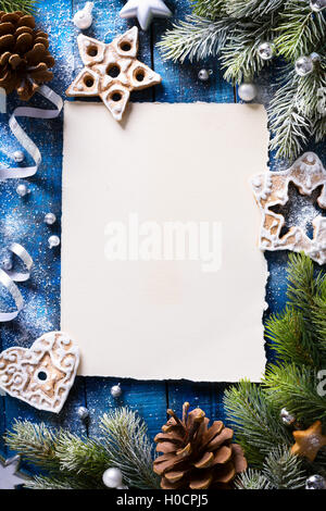 Christmas background with fir branches and Gingerbread cookies Stock Photo