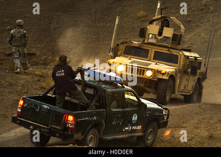 Afghan National Police officers and U.S. Army and Marine Corps soldiers park their vehicles after completing a joint patrol November 30, 2009 in Zabul province Shabbily Kalan, Afghanistan. Stock Photo