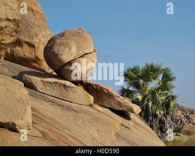 Natural sculpture made by mother nature. Splited round granite boulder. Scene in Hampi, India. Stock Photo