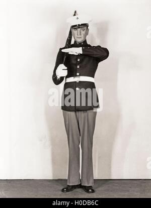 Full length portrait of marine standing at attention Stock Photo