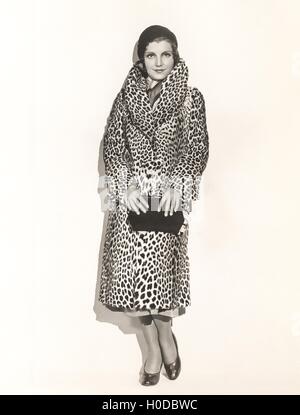 Portrait of woman wearing a leopard print coat Stock Photo