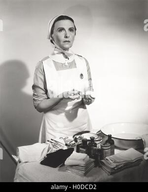 Nurse preparing syringe for injection Stock Photo