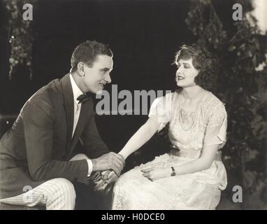 Couple holding hands in park Stock Photo