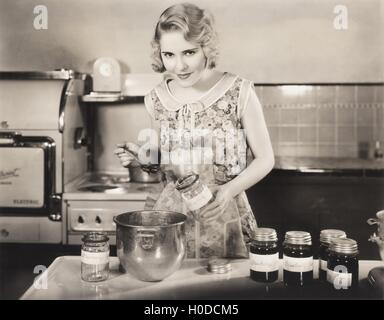 Woman making preserves Stock Photo