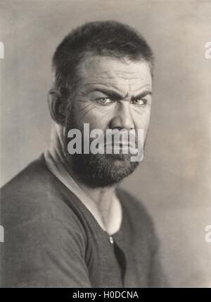 Portrait of a frowning bearded man Stock Photo