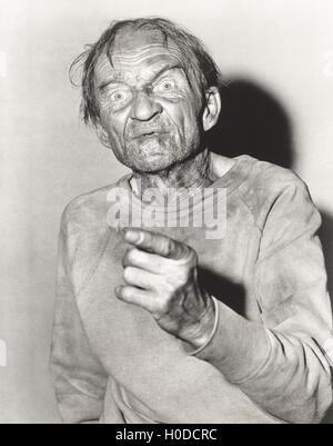 Elderly man pointing a finger Stock Photo