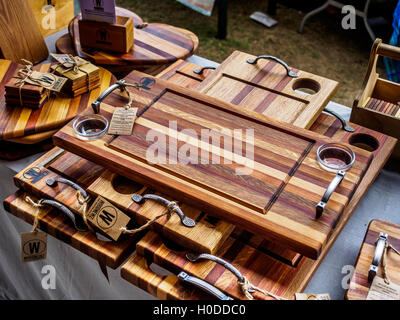 Handmade wooden items on sale at a market stall Stock Photo