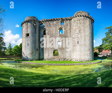 The moated medieval castle at the village of Nunney in Somerset Stock Photo