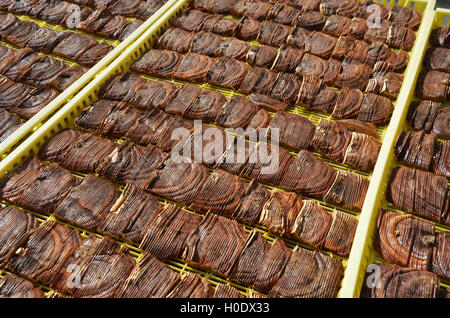 Sliced ganoderma mushroom frying on tray in asia Stock Photo