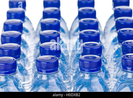 Rows of water bottles isolated on white background Stock Photo