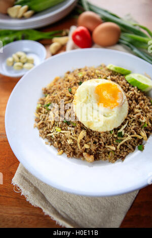 Indonesia Nasi Goreng fried rice with egg on white plate Stock Photo
