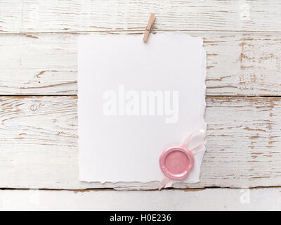 wax seal and white paper on wooden background Stock Photo