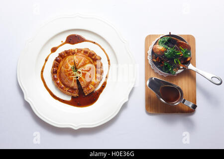 Paris rouge dish with cake, vegetables and soyal sauce on white background Stock Photo