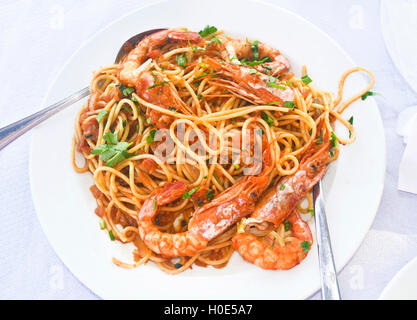 mediterranean seafood - pasta with shrimps at a greek tavern Stock Photo