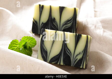 Charcoal soap deep cleansing with mint on cloth Stock Photo