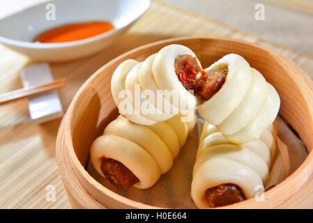 Sausage rolls in bamboo tray in asian restaurant Stock Photo