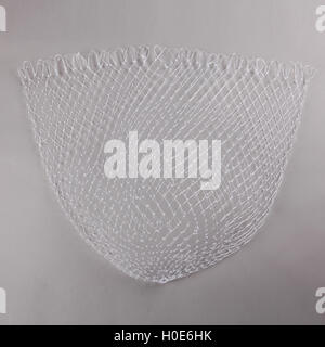 Harvest gear of white cloth mesh for fishing on grey background Stock Photo