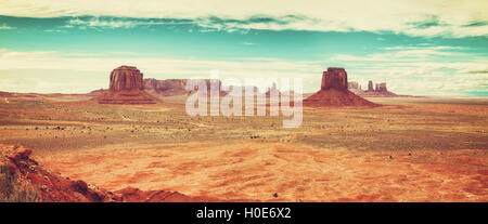 Old film retro stylized panoramic picture of Monument Valley, USA.