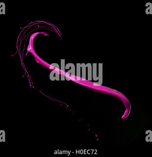 Colored paint splashes isolated on black background Stock Photo