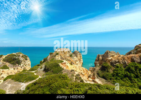 Sunshine above  Atlantic ocean summer rocky coastline (Ponta da Piedade, Lagos, Algarve, Portugal). Stock Photo