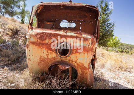 Abandoned rusted body of three-wheeled light commercial vehicle Stock Photo