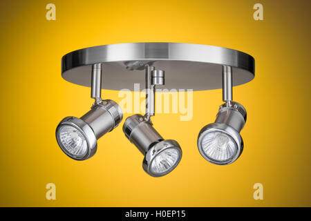 Ceiling light fixture isolated on yellow background Stock Photo
