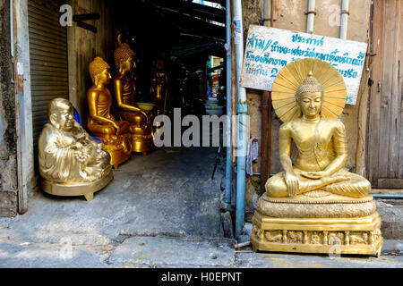 Golden Buddha statues outside a workshop in Bangkok, Thailand. Stock Photo
